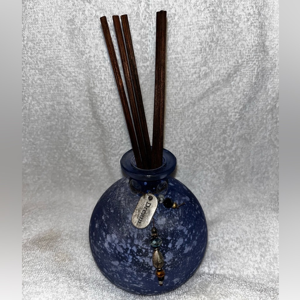 Blue incense vase with sticks to draw up scent